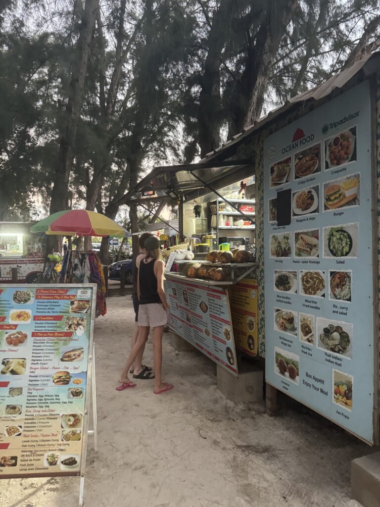 Getting amazing food from the food trucks at Trou aux biches beach